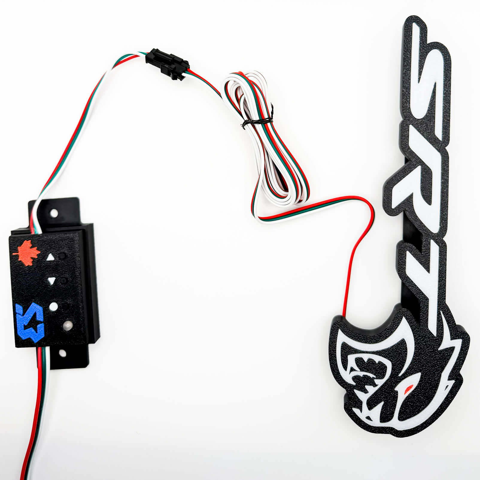 Harness running from the badge to the controller, coiled and connected